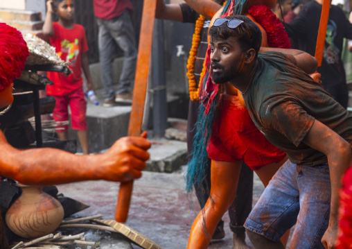 Hindu devotees covered with orange color in Lal Kach festival, Dhaka Division, Munshiganj Sadar, Bangladesh