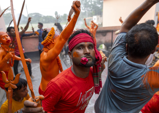 Hindu devotees covered with orange color in Lal Kach festival, Dhaka Division, Munshiganj Sadar, Bangladesh