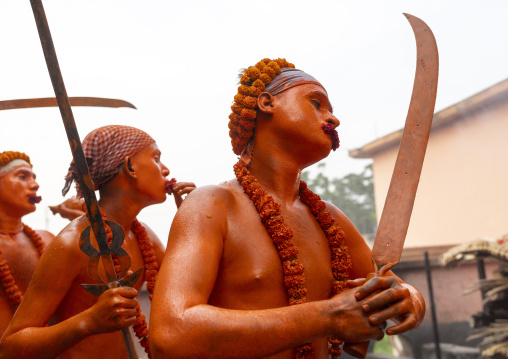 Hindu devotees covered with orange color in Lal Kach festival, Dhaka Division, Munshiganj Sadar, Bangladesh