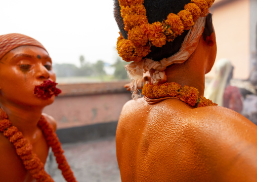 Hindu devotees covered with orange color in Lal Kach festival, Dhaka Division, Munshiganj Sadar, Bangladesh