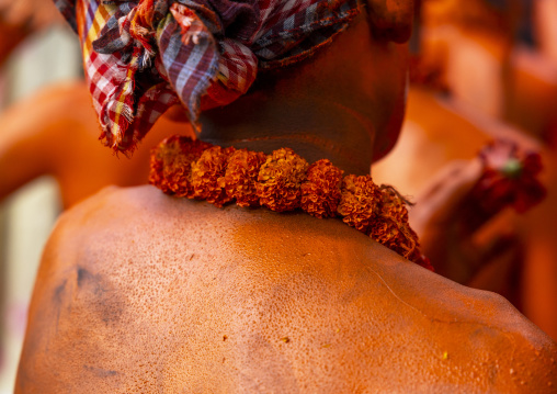 Neclace flowers of a Hindu devotee covered with red color in Lal Kach festival, Dhaka Division, Munshiganj Sadar, Bangladesh