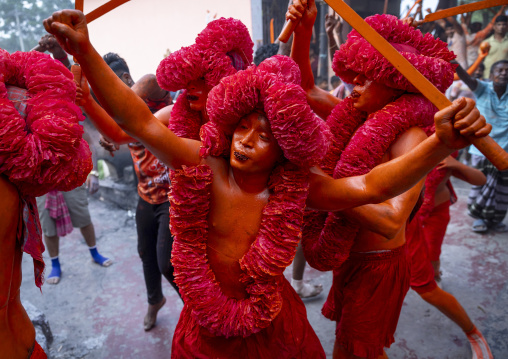 Hindu devotees covered with orange color in Lal Kach festival, Dhaka Division, Munshiganj Sadar, Bangladesh