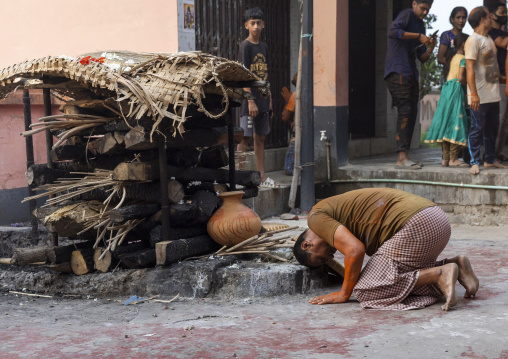 Hindu man praying at cremation site, Dhaka Division, Munshiganj Sadar, Bangladesh