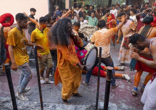 Hindu devotees covered with orange color in Lal Kach festival, Dhaka Division, Munshiganj Sadar, Bangladesh