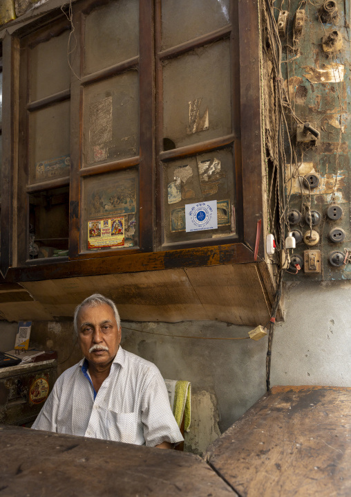 Bangladeshi man sit in his shop, Dhaka Division, Dhaka, Bangladesh