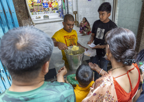 Bangladeshi people collecting food in a temple, Dhaka Division, Dhaka, Bangladesh