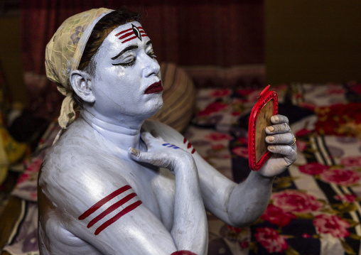 Make up of a hindu devotee who becomes Lord Shiva at Lal Kach festival, Dhaka Division, Munshiganj, Bangladesh