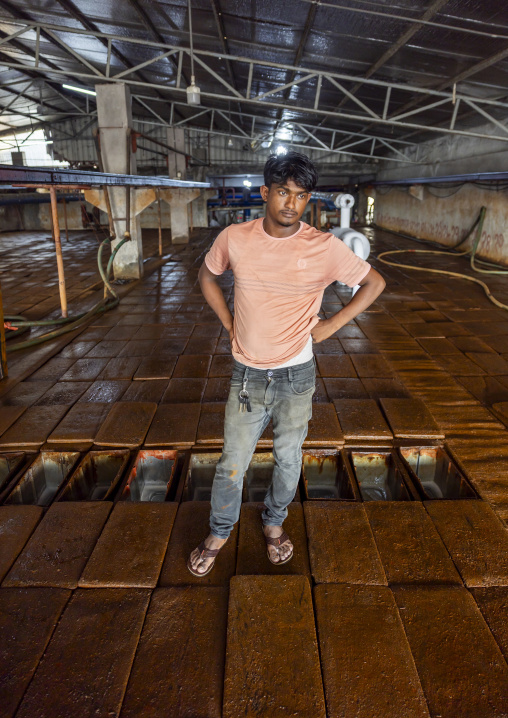 Bangladeshi man working in an ice factory in the fish market, Chittagong Division, Chittagong, Bangladesh