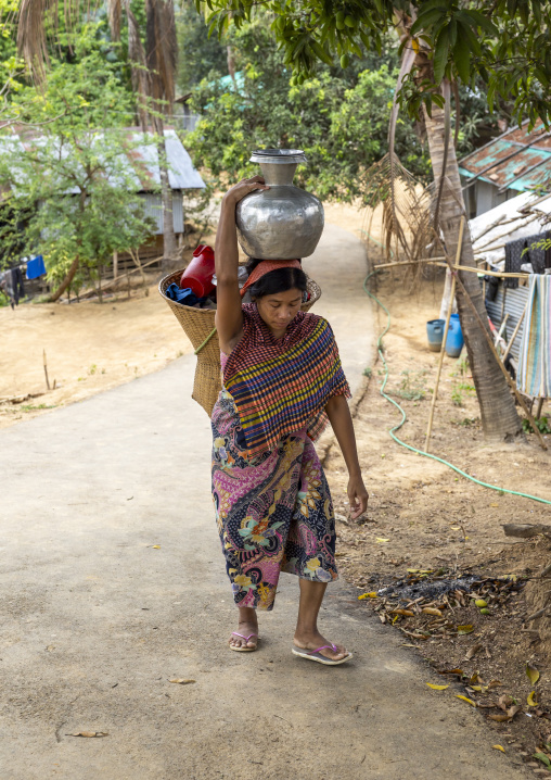 Bangladeshi woman carrying pot on her head, Chittagong Division, Rowangchhari, Bangladesh