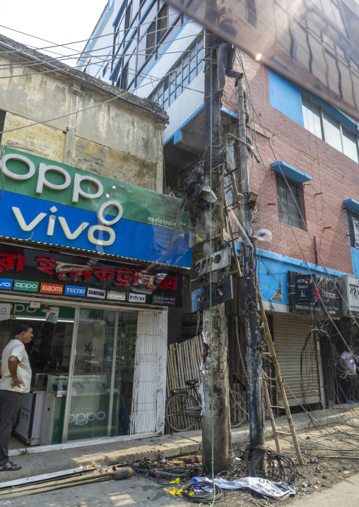 Burnt tangled wires hanging on electricity pole, Khulna Division, Jessore, Bangladesh