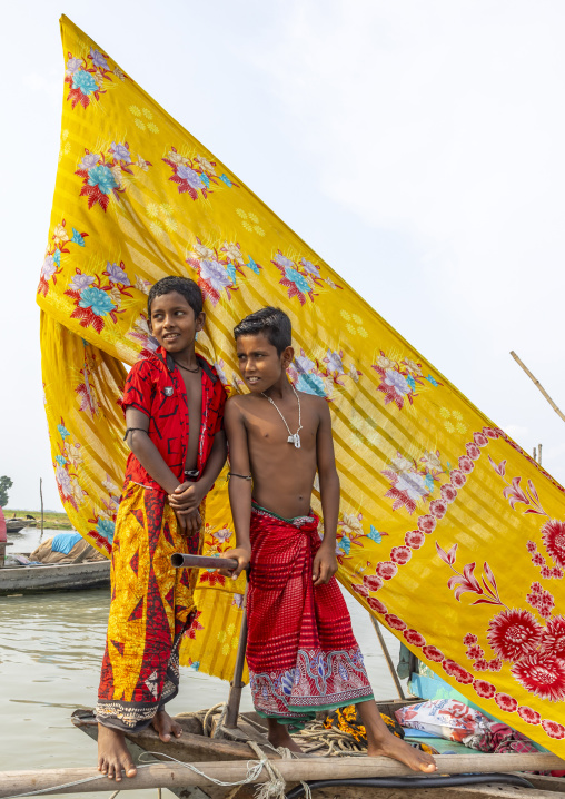 River gypsy boys living on a boat , Barisal Division, Barisal, Bangladesh