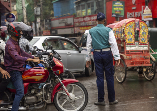 Bangladeshi traffic policeman in the street, Dhaka Division, Dhaka, Bangladesh