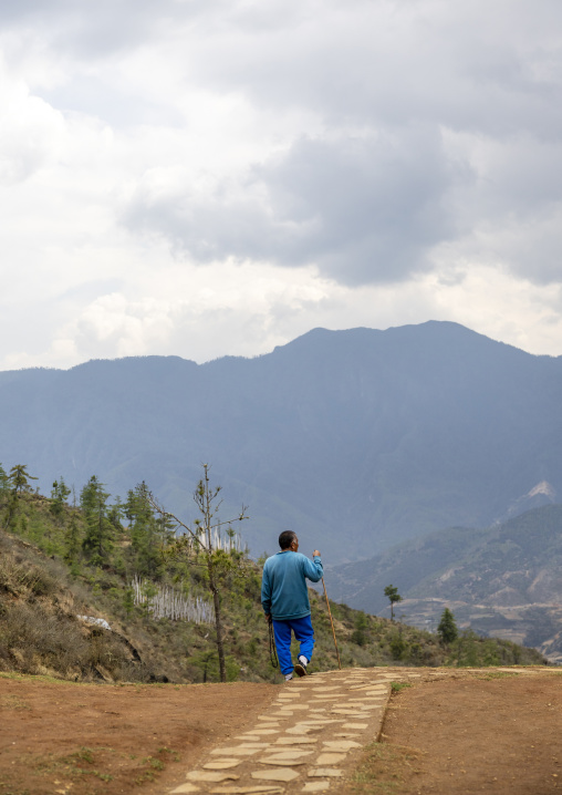 Bhutanese man hiking in the mountain, Paro, Drakarpo, Bhutan