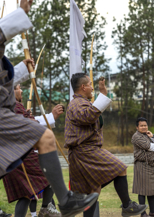 Bhutanese archers celebrating victory on an archery range, Chang Gewog, Thimphu, Bhutan