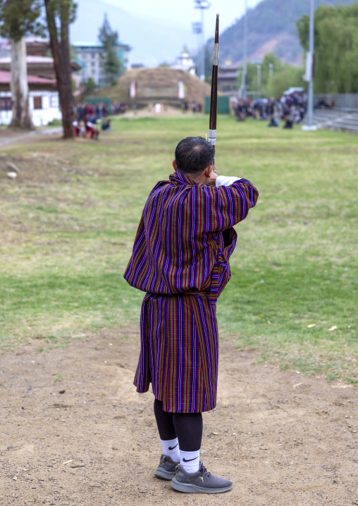 Bhutanese man aims arrow in archery competition, Chang Gewog, Thimphu, Bhutan