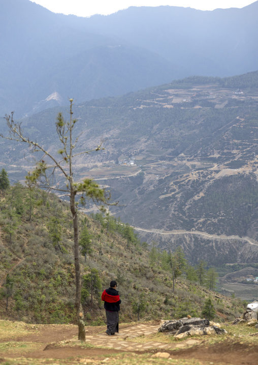 Bhutanese woman hiking in the mountain, Paro, Drakarpo, Bhutan