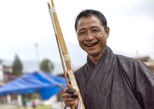 Smiling bhutanese archer with arrows in his hand, Chang Gewog, Thimphu, Bhutan