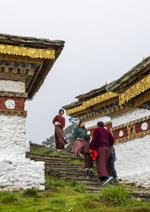Butanese pilgrims in Dochu La with 108 stupas or chortens, Punakha, Dochula Pass, Bhutan