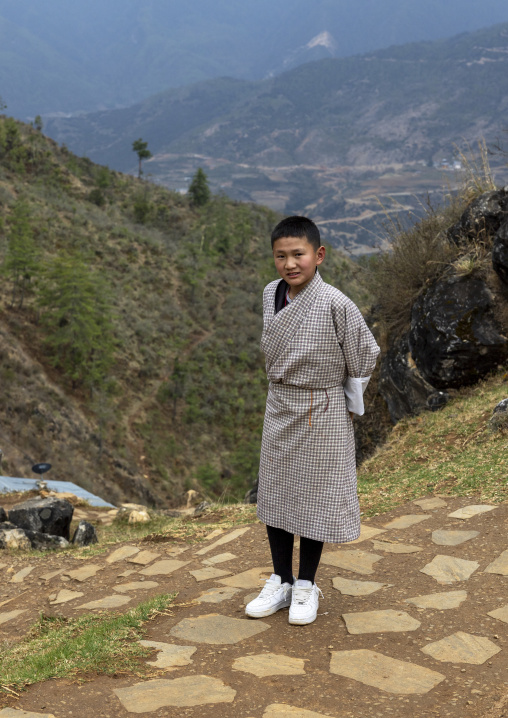 Portrait of a bhutanese boy in the hills, Paro, Drakarpo, Bhutan