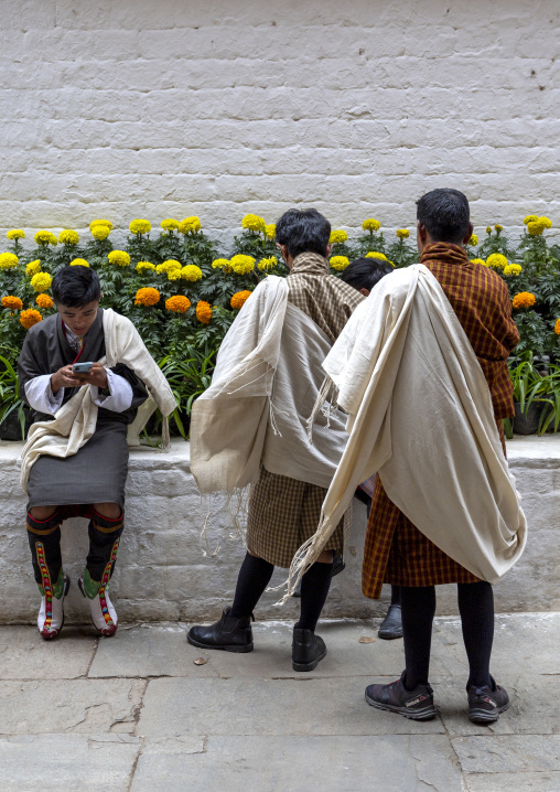 Bhutanese men with kabney scarves in Punakha Dzong, Punakha dzongkhag, Punakha, Bhutan