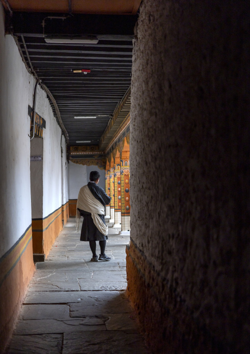 Butanese man in Punakha dzong alley, Punakha dzongkhag, Punakha, Bhutan