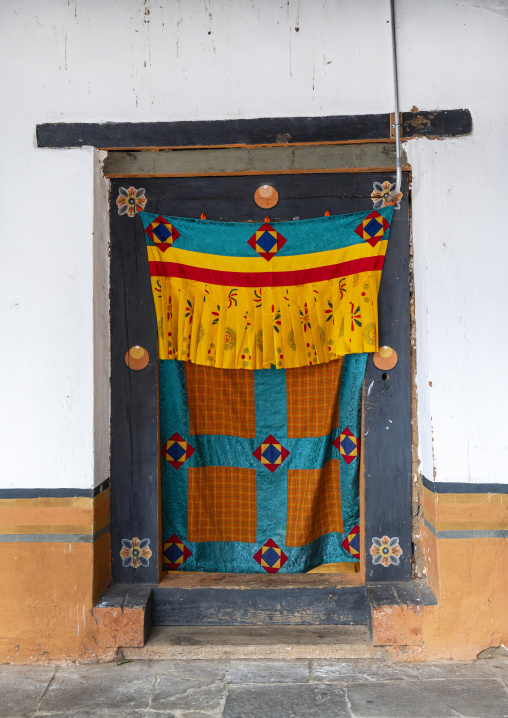 Old door with a curtain in Punakha dzong, Punakha dzongkhag, Punakha, Bhutan