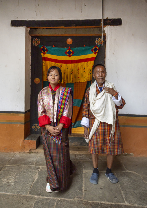 Portrait of a bhutanese girl and man in Punakha Dzong, Punakha dzongkhag, Punakha, Bhutan