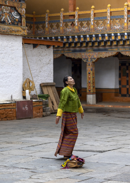 Bhutanese woman praying in Nyenzer Lhakhang, Punakha dzongkhag, Punakha, Bhutan
