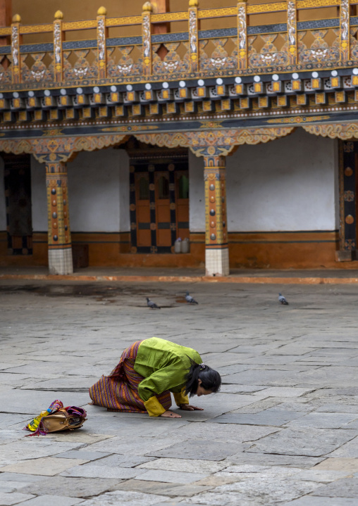 Bhutanese woman praying in Nyenzer Lhakhang, Punakha dzongkhag, Punakha, Bhutan