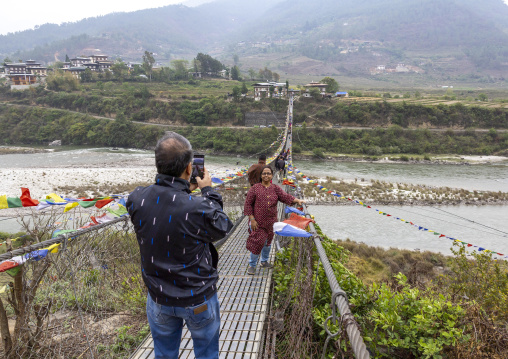 Punakha Suspension Bridge with prayer flags, Punakha dzongkhag, Punakha, Bhutan