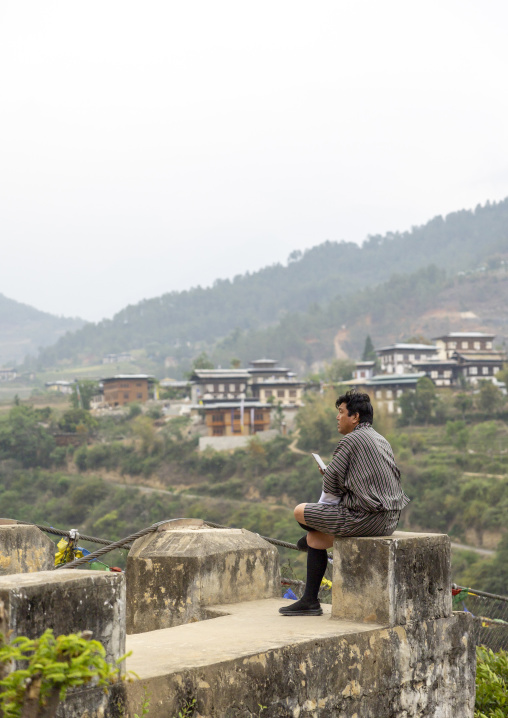 Bhutanese man with a mobile phone, Punakha dzongkhag, Punakha, Bhutan