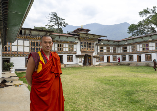 Bhutanese monk in Nyenzer Lhakhang courtyard, Thedtsho Gewog, Wangdue Phodrang, Bhutan