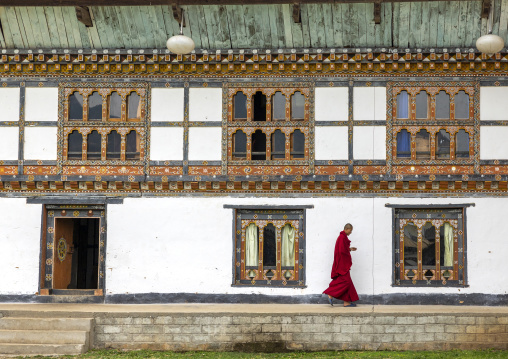 Bhutanese monk in Nyenzer Lhakhang courtyard, Thedtsho Gewog, Wangdue Phodrang, Bhutan