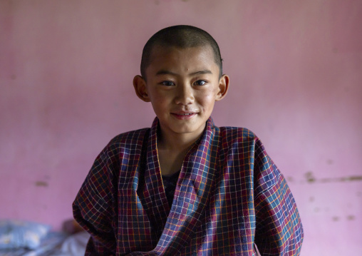 Bhutanese novice monk in Nyenzer Lhakhang, Thedtsho Gewog, Wangdue Phodrang, Bhutan