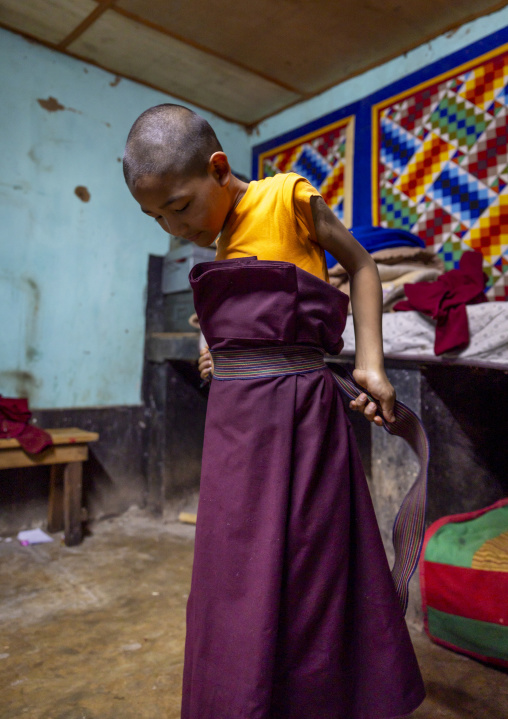 Bhutanese novice monk in Nyenzer Lhakhang dormitory, Thedtsho Gewog, Wangdue Phodrang, Bhutan