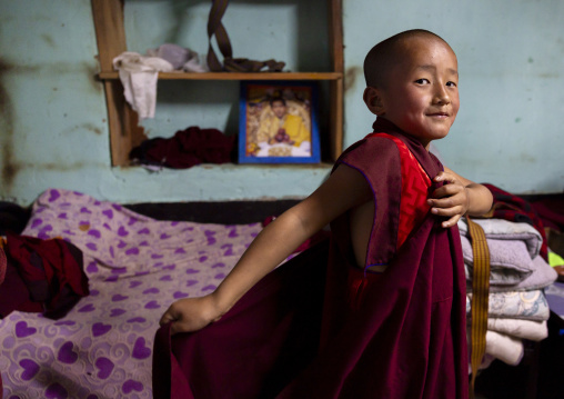 Bhutanese novice monk in Nyenzer Lhakhang dormitory, Thedtsho Gewog, Wangdue Phodrang, Bhutan