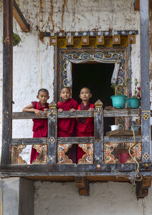 Bhutanese novices monks on balcony in Nyenzer Lhakhang, Thedtsho Gewog, Wangdue Phodrang, Bhutan