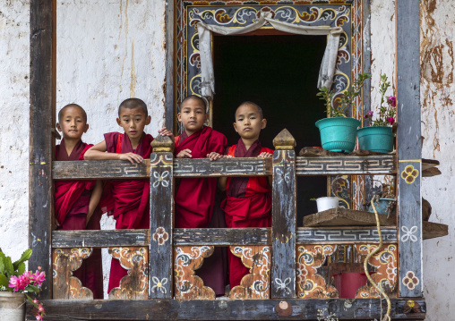 Bhutanese novices monks on balcony in Nyenzer Lhakhang, Thedtsho Gewog, Wangdue Phodrang, Bhutan