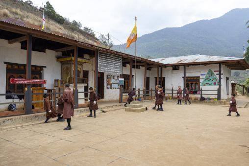Bhutanese pupils in Rubesa Primary school courtyard, Wangdue Phodrang, Rubesagewog, Bhutan