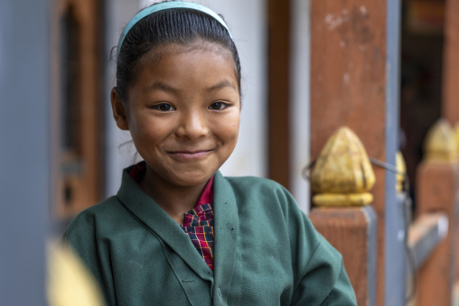 Portrait of a smiling bhutanese girl, Wangdue Phodrang, Rubesagewog, Bhutan