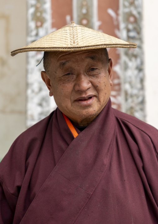 Bhutanese man with a traditional bamboo hat, Trongsa District, Trongsa, Bhutan
