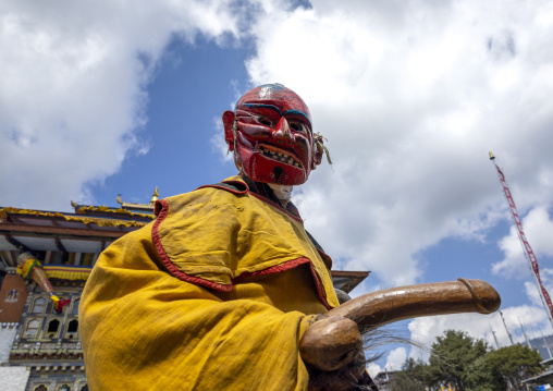 Atsara with a wooden phallus at the Ura Yakchoe festival, Bumthang, Ura, Bhutan