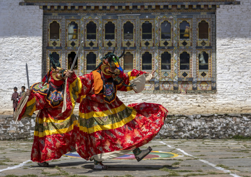 Mask dancers at the annual Ura Yakchoe festival, Bumthang, Ura, Bhutan