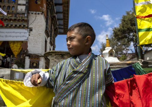 Bhutanese boy in Ura Lhakhang monastery, Bumthang, Ura, Bhutan