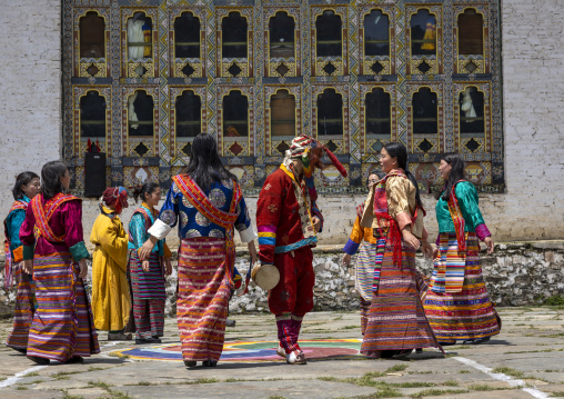 Bhutanese women dancing with an astara during Ura Yakchoe festival, Bumthang, Ura, Bhutan