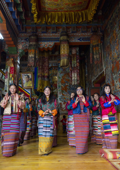 Bhutanese women dancing during Ura Yakchoe in the temple, Bumthang, Ura, Bhutan