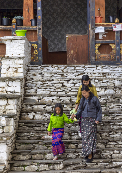 Bhutanese family on Kurjey lhakang stairs, Chhoekhor Gewog, Bumthang, Bhutan