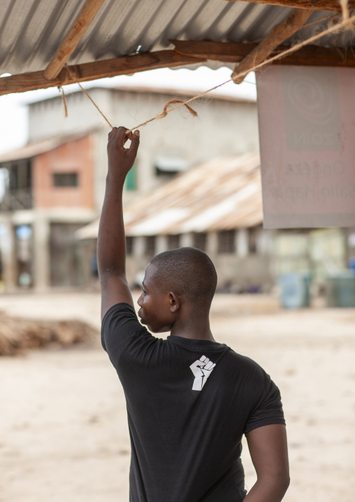 Rear view of a teenager with one arm up, Pwani province, Bagamoyo, Tanzania