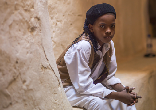 Boy with turban sit in the street, Tripolitania, Ghadames, Libya