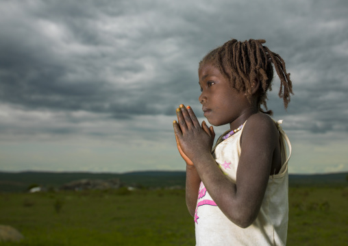 Girl with hands joineed, Huila Province, Caconda, Angola